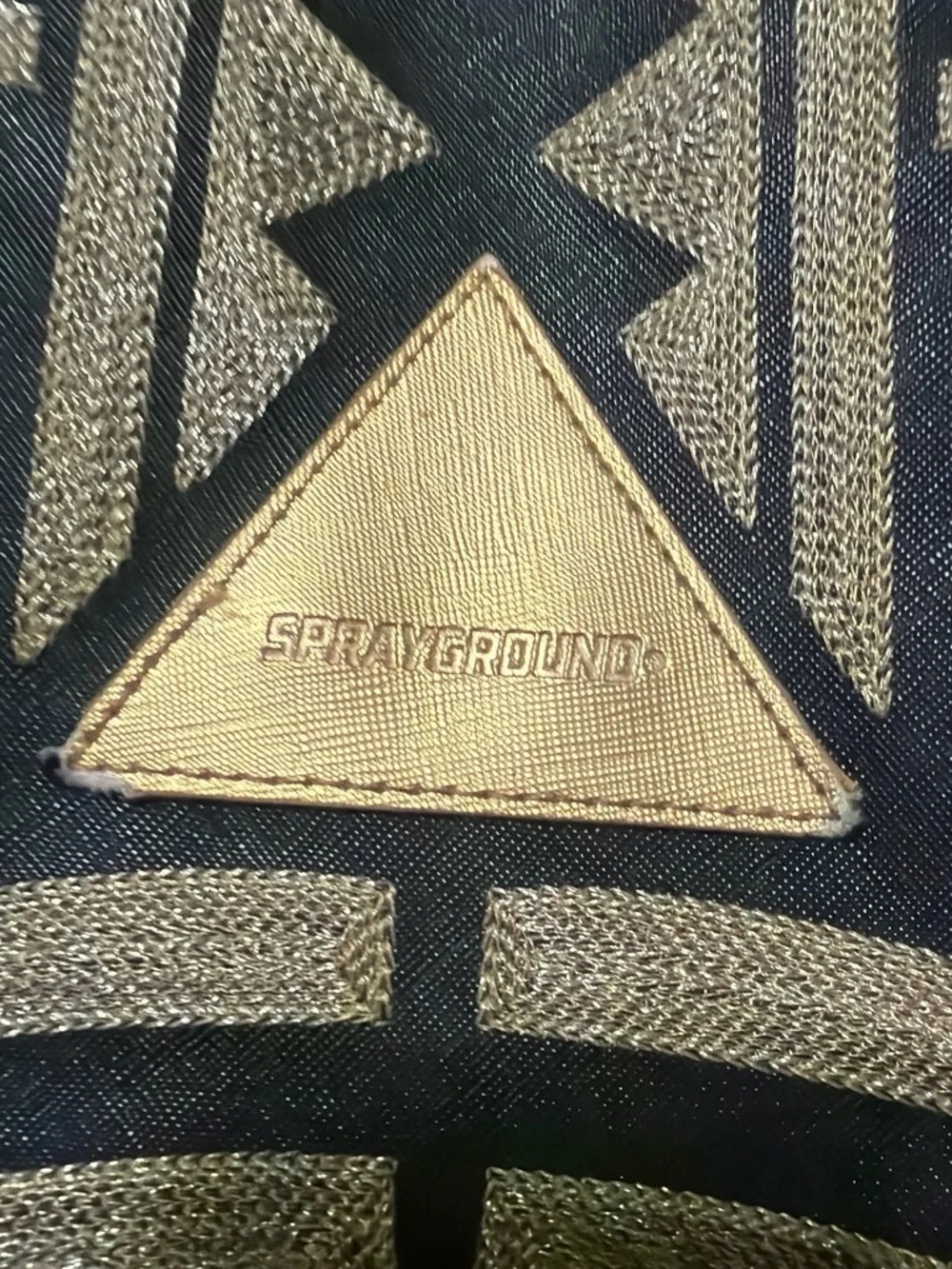 Sprayground Black Backpack with Metallic Gold Tribal Pattern